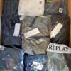 The photo shows a package with clothing in the category AM.