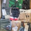 The photo shows a package with clothing in the category AM.