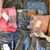 The photo shows a package with clothing in the category AM.