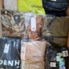 The photo shows a package with clothing in the category AM.
