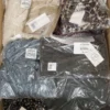 The photo shows a package with clothing in the category YA.
