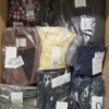 The photo shows a package with clothing in the category YA.