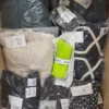 The photo shows a package with clothing in the category YA.