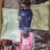 The photo shows a package with clothing in the category AR.