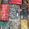 The photo shows a package with clothing in the category AR.