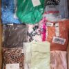 The photo shows a package with clothing in the category AR.