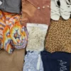 The photo shows a package with clothing in the category SN.