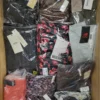The photo shows a package with clothing in the category AW.