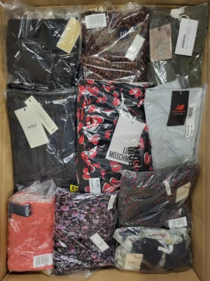The photo shows a package with clothing in the category AW.
