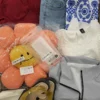 The photo shows a package with clothing in the category SN.