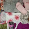 The photo shows a package with clothing in the category SN.