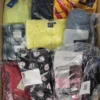 The photo shows a package with clothing in the category AW.