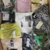 The photo shows a package with clothing in the category AW.