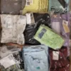 The photo shows a package with clothing in the category AW.