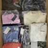 The photo shows a package with clothing in the category AW.