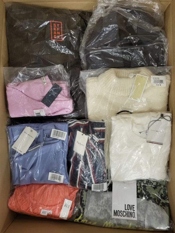 The photo shows a package with clothing in the category AW.