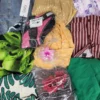 The photo shows a package with clothing in the category SN.