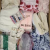 The photo shows a package with clothing in the category SN.