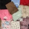 The photo shows a package with clothing in the category SN.