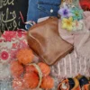 The photo shows a package with clothing in the category SN.