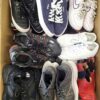 The photo shows a package with footwear in the category SH.