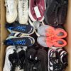 The photo shows a package with footwear in the category SH.