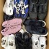 The photo shows a package with footwear in the category SH.