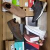 The photo shows a package with footwear in the category AS.