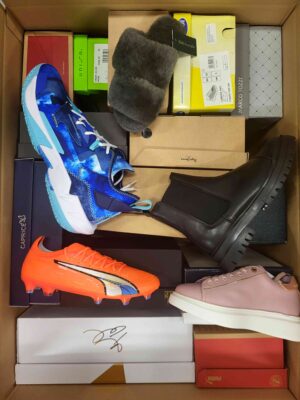 The photo shows a package with footwear in the category AS.