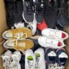 The photo shows a package with footwear in the category SH.