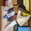 The photo shows a package with footwear in the category AS.