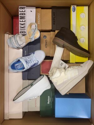 The photo shows a package with footwear in the category AS.
