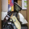 The photo shows a package with footwear in the category AS.