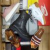 The photo shows a package with footwear in the category AS.