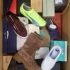 The photo shows a package with footwear in the category AS.