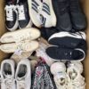 The photo shows a package with footwear in the category SH.