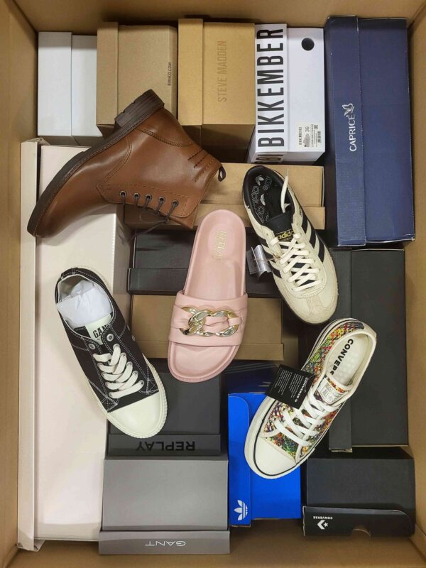 The photo shows a package with footwear in the category AS.