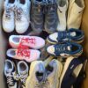 The photo shows a package with footwear in the category SH.