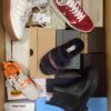 The photo shows a package with footwear in the category AS.