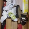 The photo shows a package with footwear in the category AS.