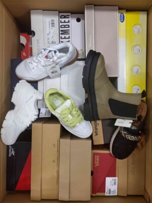 The photo shows a package with footwear in the category AS.