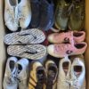The photo shows a package with footwear in the category SH.