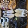 The photo shows a package with footwear in the category SH.