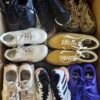 The photo shows a package with footwear in the category SH.
