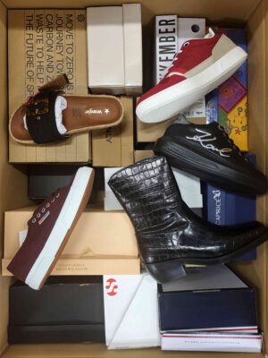 The photo shows a package with footwear in the category AS.