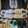 The photo shows a package with footwear in the category SH.