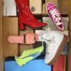 The photo shows a package with footwear in the category AS.