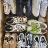 The photo shows a package with footwear in the category SH.