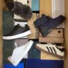 The photo shows a package with footwear in the category AS.