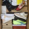 The photo shows a package with footwear in the category AS.